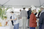 Group of People Gathering at The Drink Table at Cargill Fertilizer Inc. Grand Opening by George Skip Gandy IV