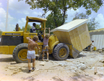 Construction Workers Securing a Wooden Shed B by George Skip Gandy IV