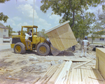 Bulldozer Lifting a Wooden Shed by George Skip Gandy IV