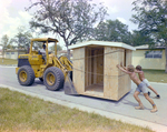 Workers Pushing a Shed Tied Onto a Bulldozer, Carlton Fields, Ward by George Skip Gandy IV