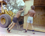 Close Up View of Two Workers Moving a Shed, Carlton Fields, Ward by George Skip Gandy IV