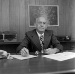 David Beebe Sitting at Desk at O.H. Carter Co. Inc., B by George Skip Gandy IV