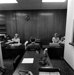 Three Employees of O.H. Carter Co. Inc. Working at Desks, A by George Skip Gandy IV