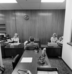 Three Employees of O.H. Carter Co. Inc. Working at Desks, C by George Skip Gandy IV