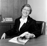 Portrait of Woman Sitting at Desk, O.H. Carter Co. Inc., A by George Skip Gandy IV