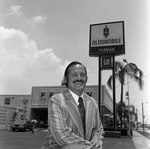 James Ferman Sr. Outside Ferman Oldsmobile in Tampa, Florida, E by George Skip Gandy IV