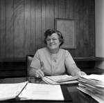 Woman Sitting at Desk at O.H. Carter Co. in Tampa, Florida, B by George Skip Gandy IV