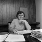 Woman Sitting at Desk at O.H. Carter Co. in Tampa, Florida, C by George Skip Gandy IV