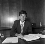 Male Employee Smiling at Desk at O.H. Carter Co. in Tampa, Florida, A by George Skip Gandy IV