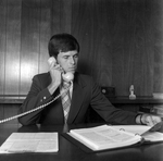 Male Employee Smiling at Desk at O.H. Carter Co. in Tampa, Florida, B by George Skip Gandy IV