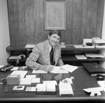 Man Sitting at Desk with Papers, O.H. Carter Co., C by George Skip Gandy IV