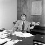 Man Sitting at Desk with Papers, O.H. Carter Co., D by George Skip Gandy IV