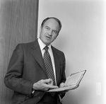 Man Holding Book at O.H. Carter Co. in Tampa, Florida, B by George Skip Gandy IV