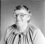 Woman with Round Glasses at O.H. Carter Co. in Tampa, Florida, B by George Skip Gandy IV