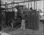 Worker Loading aPress Machine at aMill by Skip Gandy