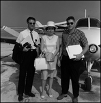 Three People Posed by Airplane, A by Skip Gandy