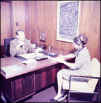 W. Scott Christopher Seated at Desk by Skip Gandy