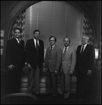 First National Bank Press Conference, Five Men Pose in Front of Window by Skip Gandy