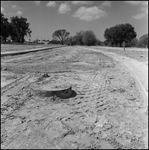 Unpaved Road in Subdivision Showing Sewer and Curbs in Place, B by Skip Gandy