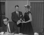 Man and Woman Pose at Florence Champlin Advertising Award Luncheon by Skip Gandy