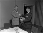 Two Men Shake Hands at Florence Champlin Advertising Award Luncheon, A by Skip Gandy