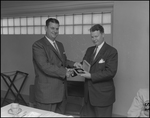 Two Men Shake Hands at Florence Champlin Advertising Award Luncheon, B by Skip Gandy