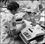 Students Work in Chevron Service Station Management Class, A by Skip Gandy