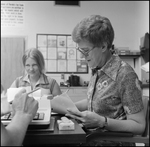 Students Work in Chevron Service Station Management Class, B by Skip Gandy