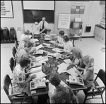 Students Work in Chevron Service Station Management Class, L by Skip Gandy