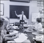 Students Work in Chevron Service Station Management Class, V by Skip Gandy