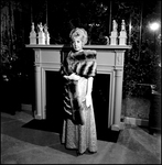 Woman Modeling Fur Coat Near Fireplace, F by George Skip Gandy IV