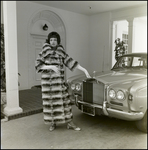 Woman Modeling Fur Coat Near Car, A by George Skip Gandy IV