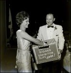 Winner of the Miss Chiropractic 2nd Alt World Queen Removing a Deposit Exhibitor Slip, Tampa, Florida by George Skip Gandy IV