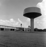 Water Tower Near a Building, B by George Skip Gandy IV