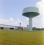 Water Tower Near a Building, C by George Skip Gandy IV