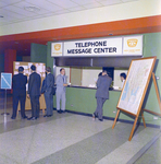 Individuals Gather at a Telephone Message Center in the Curtis Hixon Convention Center, Tampa, Florida, A by George Skip Gandy IV