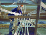 Employee Working with a Fiberglass Loom, B by George Skip Gandy IV