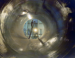 Employee Standing on a Ladder Inside Large Pipe, E by George Skip Gandy IV