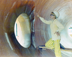 Employee Painting the Inside of a Large Pipe, F by George Skip Gandy IV