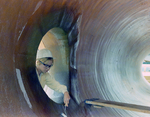 Employee Painting the Inside of a Large Pipe, G by George Skip Gandy IV