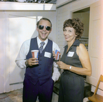 Hampton Copeland and an Attendee Pose for a Photo at a Cosmopolitan Realty and Investment Corp. Event by George Skip Gandy IV