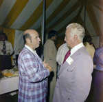 Bill Drew and an Attendee Socialize by the Refreshment Area During a Cosmopolitan Realty and Investment Corp. Event by George Skip Gandy IV