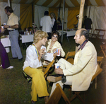 Attendees Socialize Near Refreshment Area During a Cosmopolitan Realty and Investment Corp. Event by George Skip Gandy IV