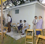 Attendees Socialize at a Cosmopolitan Realty and Investment Corp. Event, H by George Skip Gandy IV