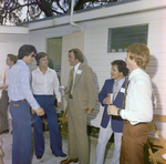 Five Attendees Socialize During a Cosmopolitan Realty and Investment Corp. Event by George Skip Gandy IV