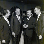 Four Attendees Socialize at a Maas Brothers Executives Reception for Imprevu by Coty, B by George Skip Gandy IV