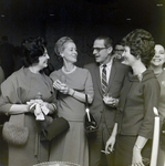 Four Attendees Socialize at a Maas Brothers Executives Reception for Imprevu by Coty, C by George Skip Gandy IV