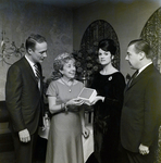 Nancy Adams and Three Attendees Pose for a Photo at a Maas Brothers Executives Reception for Imprevu by Coty by George Skip Gandy IV