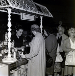 Customers Stand in Line to Sample Coty Products at a Maas Brothers Department Store, A by George Skip Gandy IV