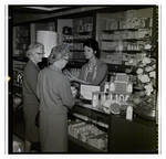 Nancy Adams Presents Imprevu by Coty to Two Customers at a Maas Brothers Department Store by George Skip Gandy IV